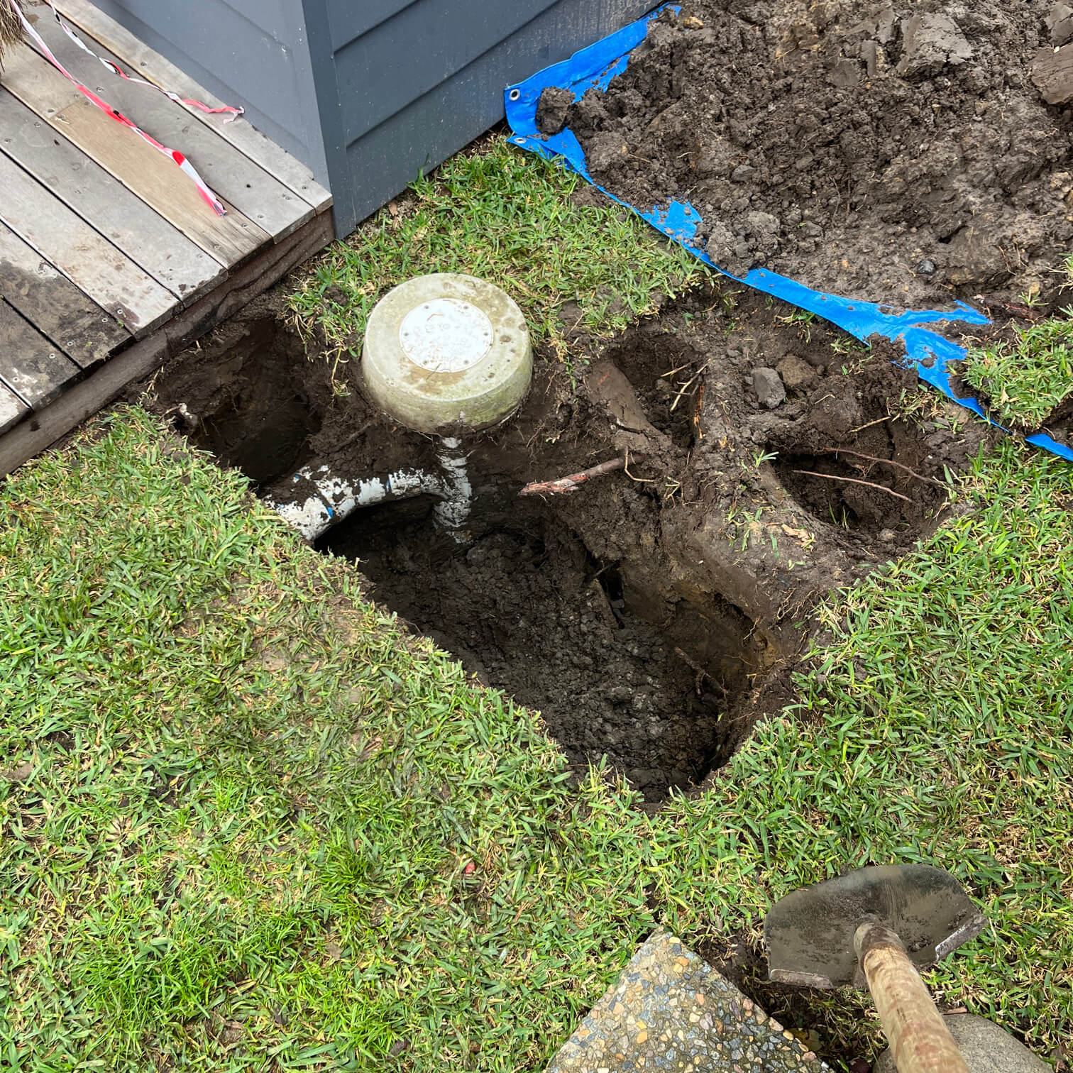 a plumber fixing a blocked drain in mona vale sydney