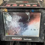 CCTV drain inspection identifying root damage inside a pipe